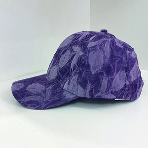 Detailed side view of purple baseball cap featuring unique pleated texture fabric