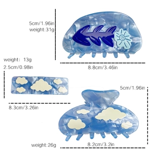 Three-piece light blue acetate hair claw clips set with cloud and floral patterns