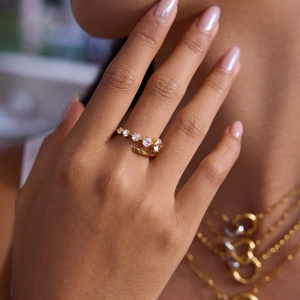 Classic 18K gold plated stainless steel ring with white zircons on model hand