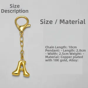 Detail view of 18k gold letter A keychain with 10cm chain and metal charm dimensions