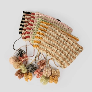 Colorful striped knit hats with tassel accents in diverse summer colors and patterns