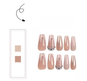 Detail of glitter coffin press-on nails with rhinestones and french tip designs