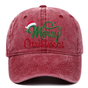 Detail of Santa Merry Christmas embroidery on washed red vintage cotton baseball cap