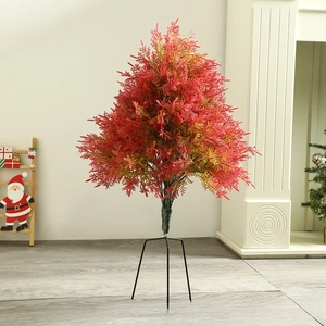 Detailed view of artificial red Christmas tree with sturdy black tripod metal base stand