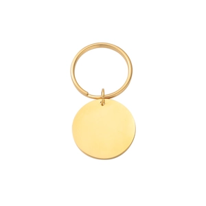 Close-up of golden stainless steel round charm with a matching key ring for engraving