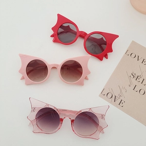 Trendy bat-wing shaped sunglasses in red and pink colors for creative fashion style