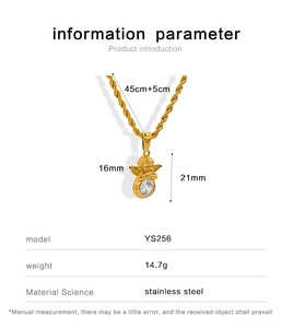 Detail of vintage golden angel wing pendant necklace with stainless steel twist chain
