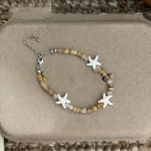 Starfish beaded strand bracelet with brown beads and adjustable silver chain