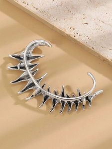 Detailed view of punk silver dragon ear cuff with spiked thorns and zircon texture