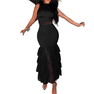 Detail of elegant black sleeveless turtleneck dress with layered mesh fishtail hemline