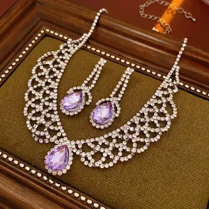 Vintage silver-plated necklace and earring set with purple teardrop crystals