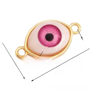 Detail showing pink Turkish eye jewelry connector with gold frame and sizing dimensions