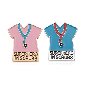 Detailed view of enamel badges featuring medical scrubs and Superhero in Scrubs text