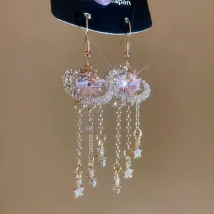 French palace style gold tassel earrings with pink oval crystals and star pendants