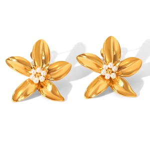 Detailed close-up of 18k gold stainless steel flower earrings with small pearl stamens