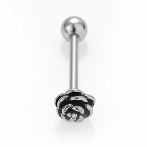 Detailed macro view of an intricate silver rose tongue piercing stud in stainless steel