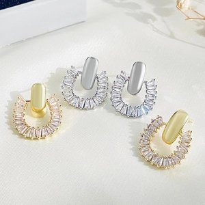 Luxe gold and silver hoop earrings with rectangular cubic zirconia in a modern design