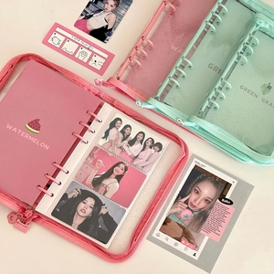 Close-up of A5 glitter PVC binder journals in pink and mint green with zipper closure
