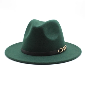 Detail of dark green wool fedora hat featuring a black band with a gold chain buckle