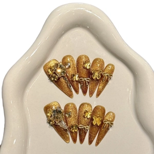 Luxurious handmade golden press-on nails with 3D metal butterflies and sparkling rhinestones