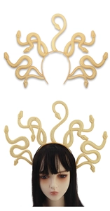 Detailed view of golden Medusa snake headpiece with intricate scale texture on a headband