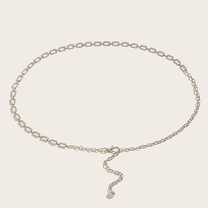 Detail of silver rhinestone waist chain featuring rectangular links and adjustable clasp