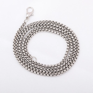 Detailed view of silver braided necklace chain with a secure lobster clasp closure