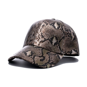 Faux leather snake skin baseball cap with textured brown animal print on white background