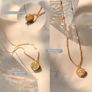 Collier en acier titane doré avec pendentif Xi et Fu double face et détails en zircon