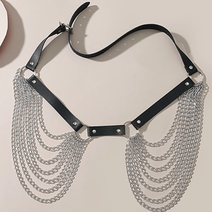 Detail of punk black PU leather body chain featuring silver metal rings and multi-layer tassels