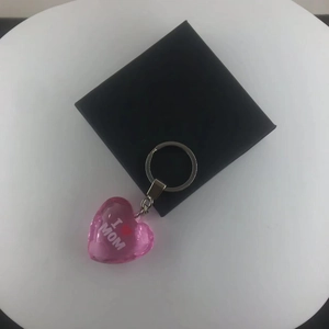 Pink acrylic heart keychain with I LOVE MOM engraving and metal ring in a gift box