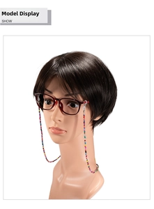 Detail showing colorful beaded eyewear chain on red spectacle frames for multi-use
