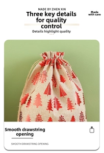 Detail of burlap Christmas gift bag featuring smooth drawstring opening and red tree pattern