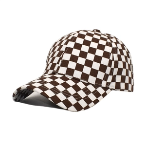 Detailed close-up of brown and white checkered canvas texture on a baseball cap