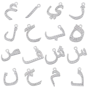 Arabic alphabet pendants in silver copper with sparkling zircon paving on white background