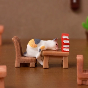 Realistic miniature calico cat figurine with desk, chair, and books for micro landscape