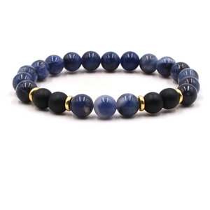 Close-up of 8mm beaded bracelet featuring blue stones and matte black beads with gold spacers