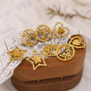 Golden stainless steel stud earrings set with Tree of Life, heart and star designs
