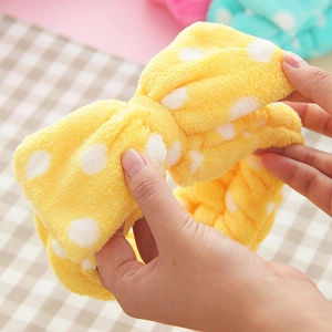 Soft yellow polka dot coral fleece headband for face washing with elastic bow design