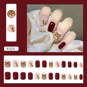Short square red press-on nails featuring cute cartoon tiger patterns and solid wine color