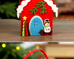 Detail of red felt Christmas gift bag featuring 3D snowman and holiday tree decorations