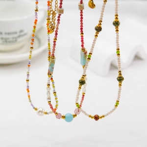 Handmade beaded necklace with pearls and natural stones in a colorful bohemian style