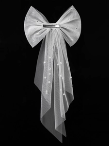 Detail of white mesh bow hair clip with scattered pearls and metal duckbill clip back