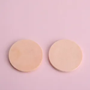 Set of two soft round makeup sponges for foundation application on pink background