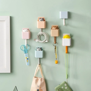 Cartoon animal wall hooks for keys and hats featuring cat and bear designs in multiple colors