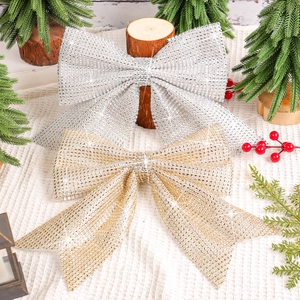 Sparkling gold and silver Christmas bow ornaments with sequins for tree decoration