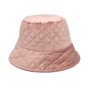 Detail of pink quilted diamond pattern on soft velvet winter bucket hat for women