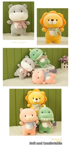 Close-up of soft plush toy collection featuring a lion and dinosaur with knit scarves