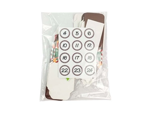 DIY Christmas advent calendar set with colorful gift boxes and numbered stickers for gifts