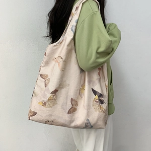 Retro style beige canvas tote bag with realistic butterfly prints for women